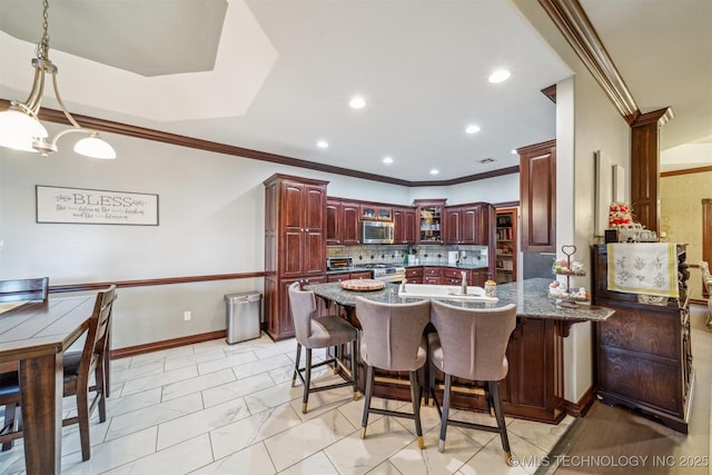 kitchen with tasteful backsplash, ornamental molding, a peninsula, dark brown cabinets, and stainless steel appliances