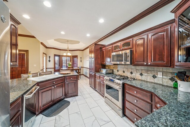 kitchen featuring ornamental molding, backsplash, stainless steel appliances, marble finish floor, and a sink