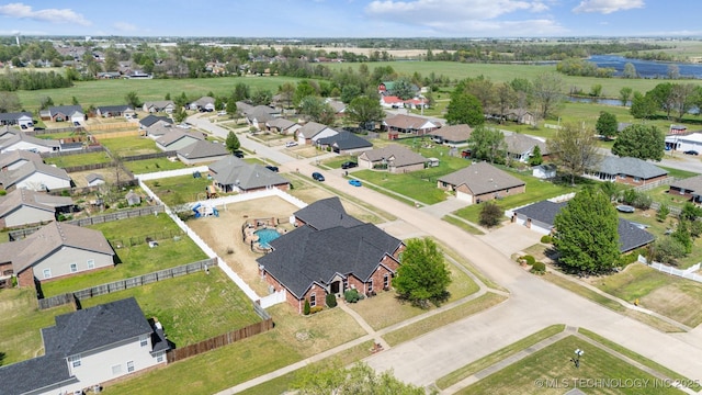 birds eye view of property with a residential view