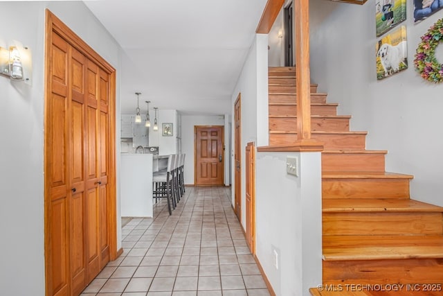 stairs with tile patterned floors