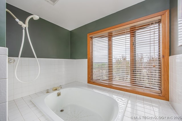 full bath featuring a relaxing tiled tub