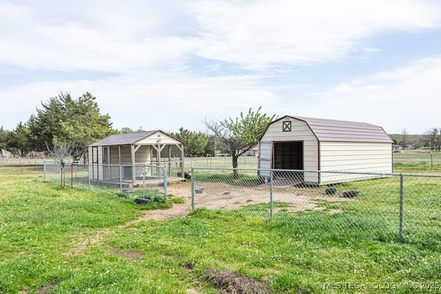view of yard with a storage shed, fence, and an outdoor structure