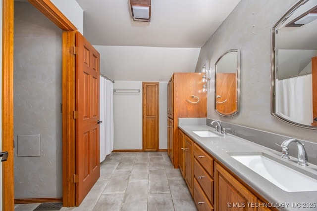 bathroom with double vanity and a sink