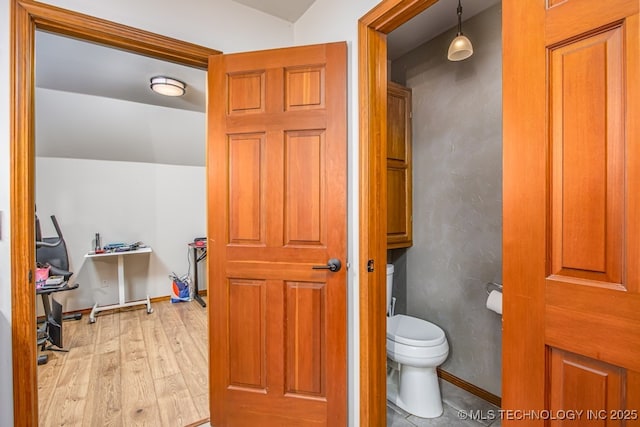 bathroom featuring toilet and wood finished floors
