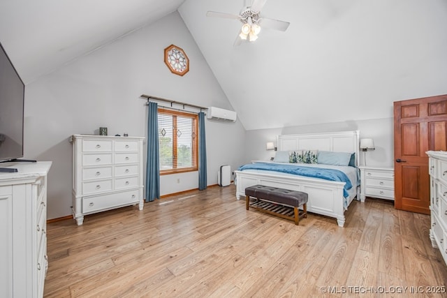 bedroom with a wall unit AC, light wood finished floors, baseboards, and a ceiling fan