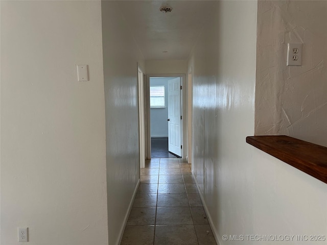 236 Bluebird Ln, Colbert, OK 74733 - hallway with baseboards and tile patterned floors