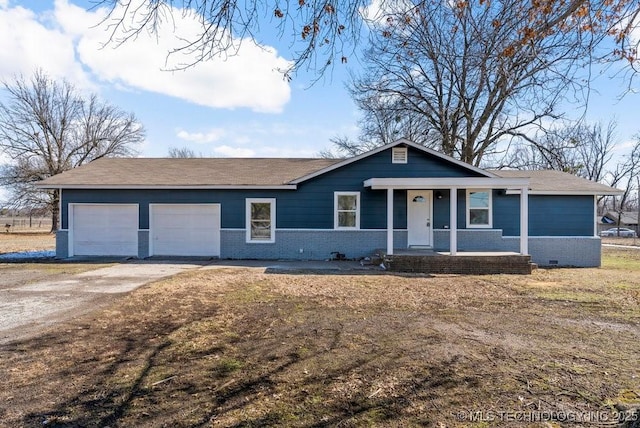 ranch-style home with brick siding, dirt driveway, an attached garage, and roof with shingles
