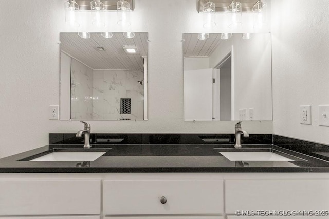 bathroom featuring double vanity and a sink