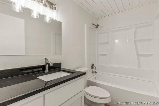 bathroom featuring toilet, shower / bath combination, and vanity