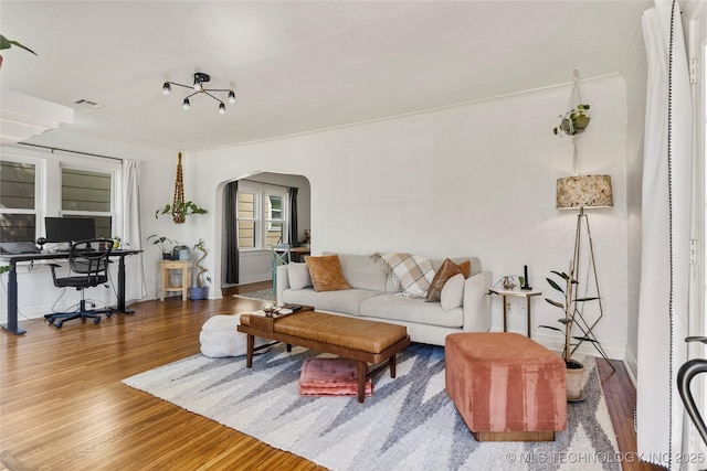 1235 S Atlanta Pl, Tulsa, OK 74104 - living room with arched walkways, visible vents, and crown molding