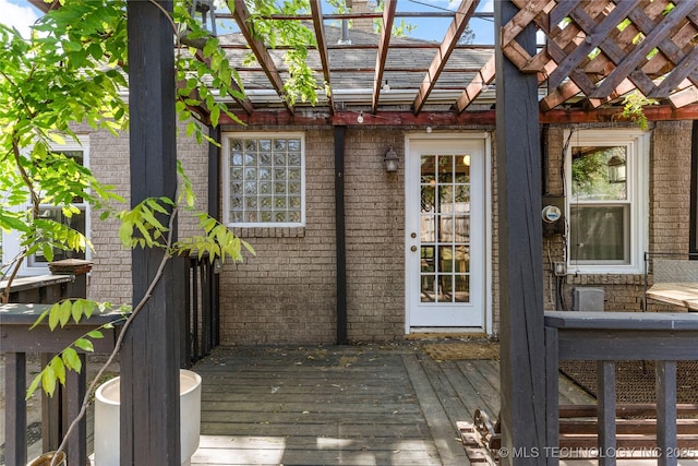 1235 S Atlanta Pl, Tulsa, OK 74104 - exterior space featuring a wooden deck, a pergola, and brick siding