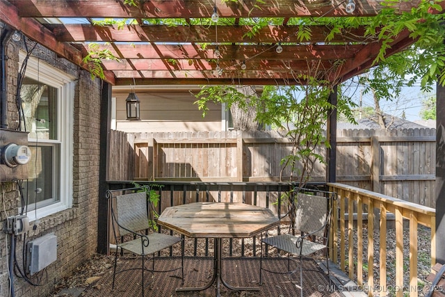 1235 S Atlanta Pl, Tulsa, OK 74104 - wooden terrace featuring fence, outdoor dining area, and a pergola