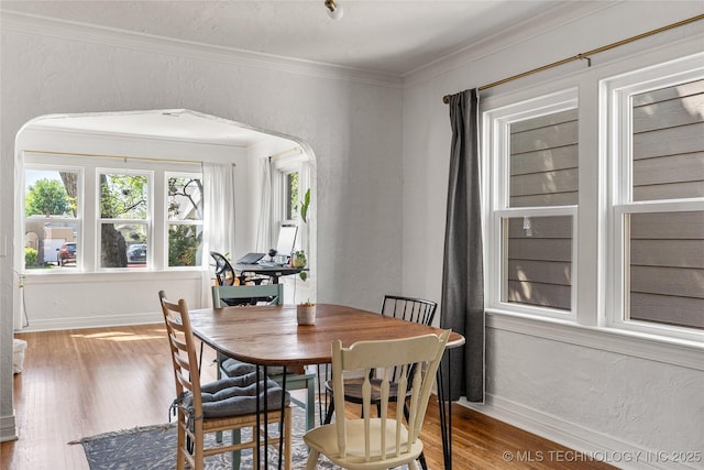1235 S Atlanta Pl, Tulsa, OK 74104 - dining space featuring crown molding, wood finished floors, and baseboards