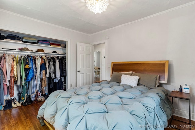 1235 S Atlanta Pl, Tulsa, OK 74104 - bedroom featuring wood finished floors, a closet, and ornamental molding