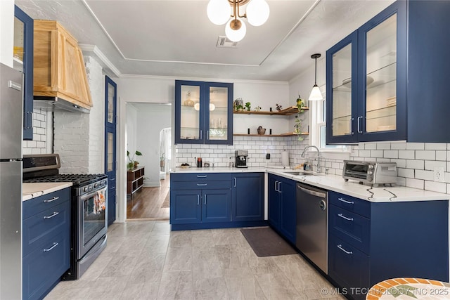 1235 S Atlanta Pl, Tulsa, OK 74104 - kitchen with tasteful backsplash, blue cabinetry, visible vents, appliances with stainless steel finishes, and a sink