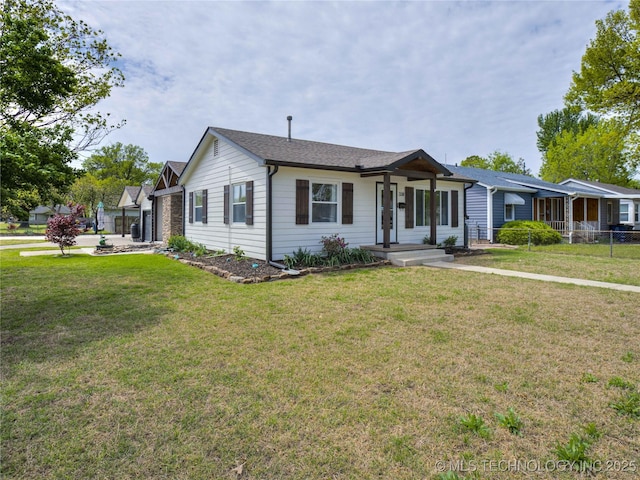 single story home featuring fence and a front lawn