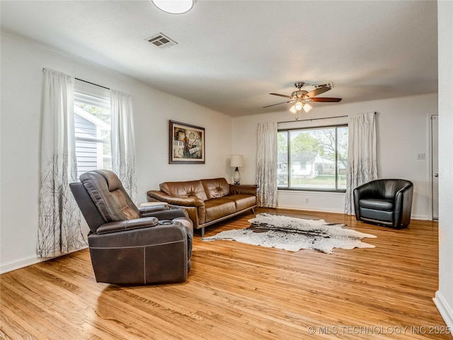 338 E 45th Pl, Tulsa, OK 74105 - living area with healthy amount of natural light, wood finished floors, and ceiling fan