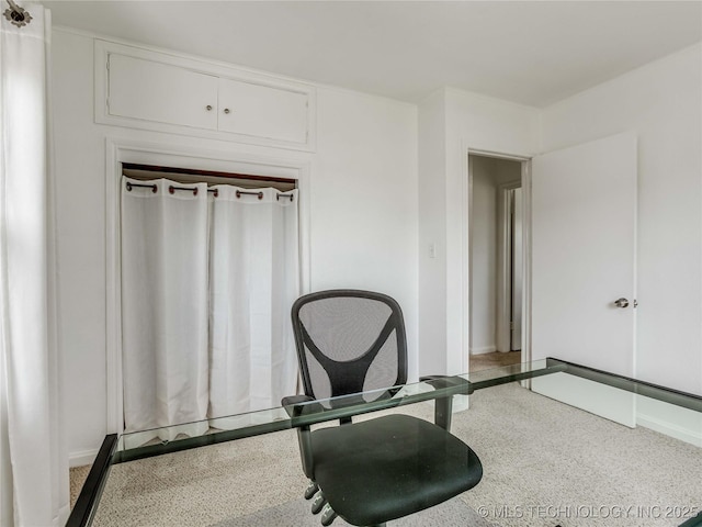 interior space with baseboards and speckled floor