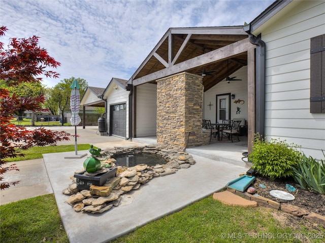 338 E 45th Pl, Tulsa, OK 74105 - view of patio / terrace featuring ceiling fan and an attached garage