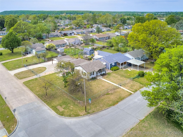 birds eye view of property with a residential view