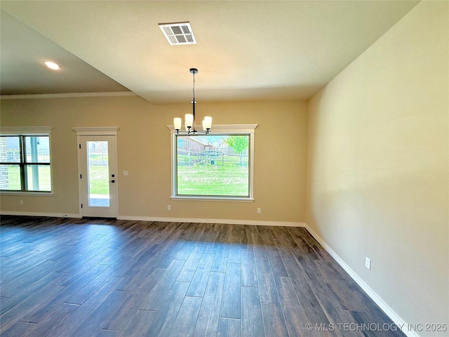 interior space with baseboards, visible vents, an inviting chandelier, and dark wood finished floors