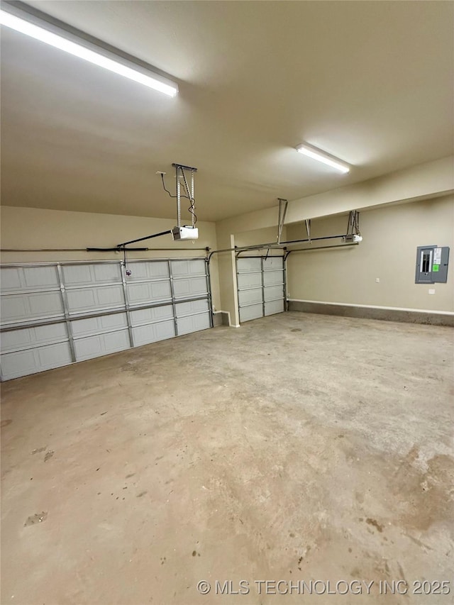 garage featuring a garage door opener and electric panel