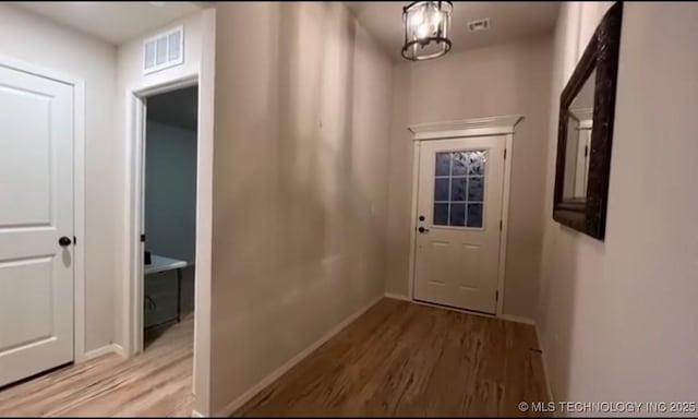 6370 E 124th Ct, Bixby, OK 74008 - doorway featuring wood finished floors and baseboards