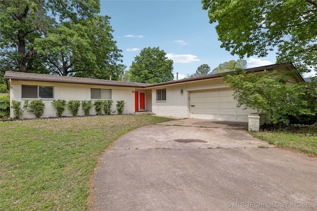 5656 S Zunis Ave, Tulsa, OK 74105 - single story home featuring a garage, concrete driveway, a front yard, and brick siding