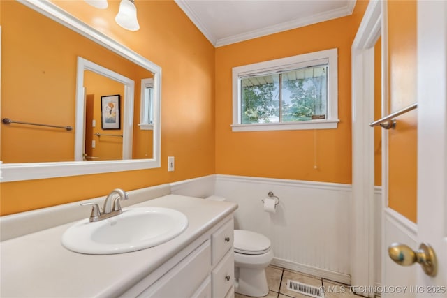 5656 S Zunis Ave, Tulsa, OK 74105 - bathroom with vanity, toilet, a wainscoted wall, crown molding, and tile patterned flooring