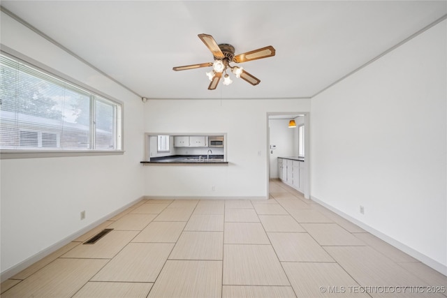 5656 S Zunis Ave, Tulsa, OK 74105 - unfurnished room with a sink and a ceiling fan