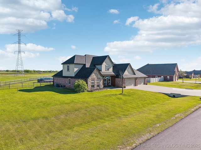 6199 E 144th St N, Collinsville, OK 74021 - view of front of home featuring stone siding, concrete driveway, and a garage