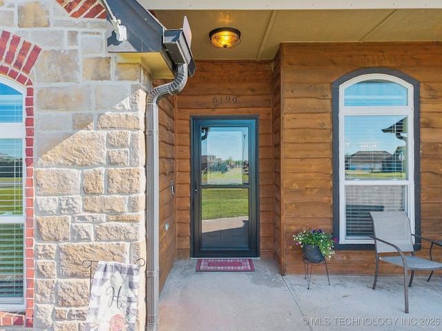 6199 E 144th St N, Collinsville, OK 74021 - entrance to property with a porch