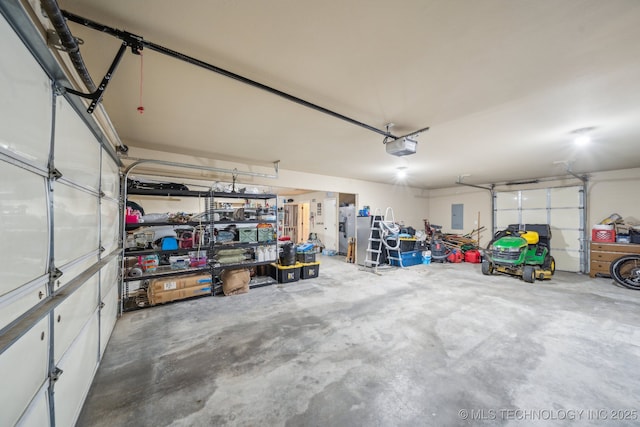 6199 E 144th St N, Collinsville, OK 74021 - garage featuring electric panel and a garage door opener