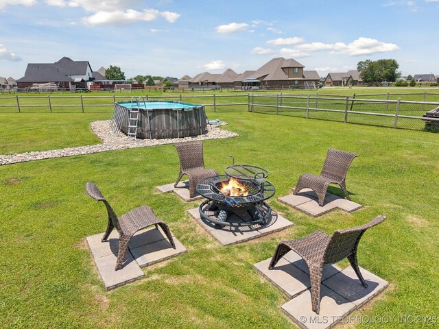 6199 E 144th St N, Collinsville, OK 74021 - view of yard with an outdoor fire pit and a residential view
