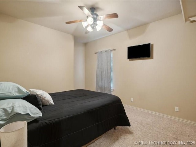 bedroom with baseboards, a ceiling fan, and carpet flooring