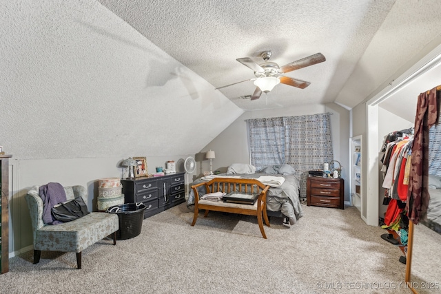 4208 W Urbana St S, Broken Arrow, OK 74012 - carpeted bedroom with a textured ceiling, vaulted ceiling, a ceiling fan, a closet, and a walk in closet