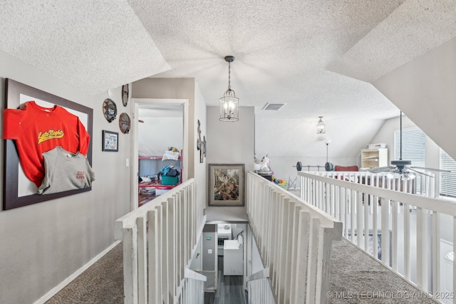 4208 W Urbana St S, Broken Arrow, OK 74012 - hall featuring a textured ceiling, baseboards, carpet floors, lofted ceiling, and an upstairs landing