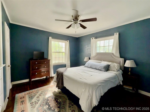 bedroom with ceiling fan, baseboards, ornamental molding, and wood finished floors