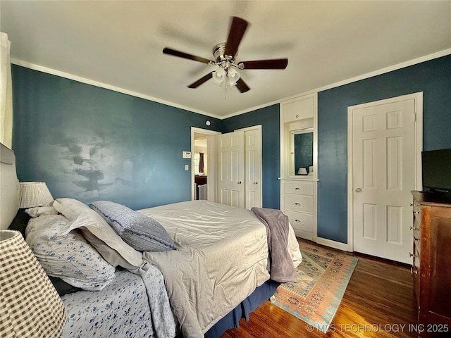 bedroom with a closet, ornamental molding, a ceiling fan, and wood finished floors