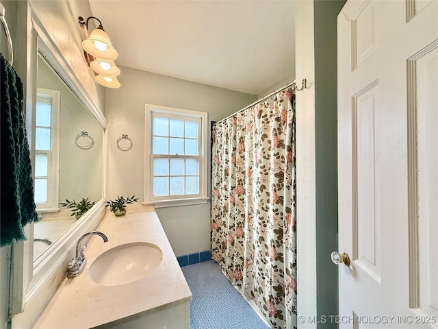 full bathroom with vanity and curtained shower