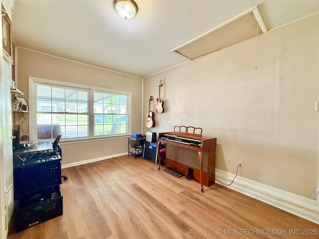 office featuring wood finished floors and baseboards
