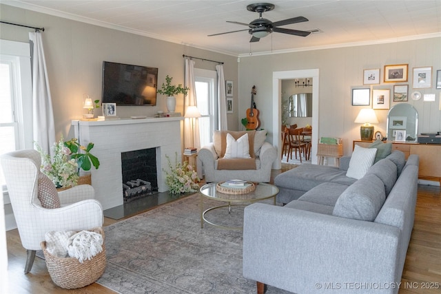 511 N Main St, Sand Springs, OK 74063 - living area with wood finished floors, ceiling fan, crown molding, and a fireplace