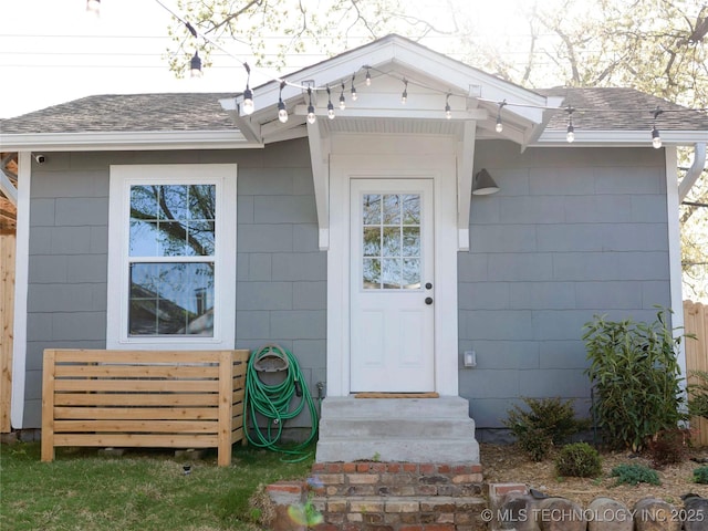 511 N Main St, Sand Springs, OK 74063 - doorway to property featuring a shingled roof