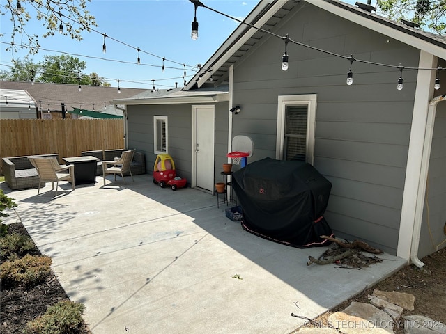 511 N Main St, Sand Springs, OK 74063 - rear view of house with fence, a patio area, and an outdoor fire pit