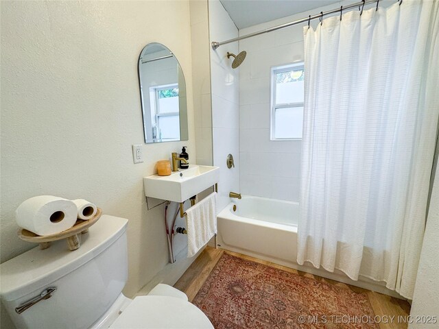 511 N Main St, Sand Springs, OK 74063 - bathroom with toilet, shower / bathtub combination with curtain, and wood finished floors
