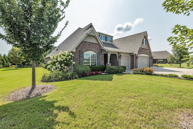 11439 N 162nd E Ave, Owasso, OK 74055 - view of front of home featuring concrete driveway, brick siding, a front lawn, and a shingled roof
