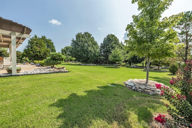 11439 N 162nd E Ave, Owasso, OK 74055 - view of green lawn with a patio