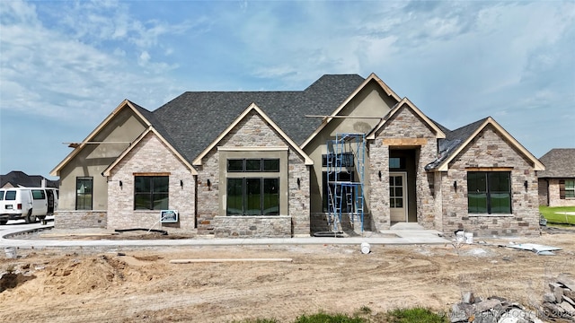 17806 S 46 E Ave, Bixby, OK 74008 - view of front facade featuring stone siding, stucco siding, and roof with shingles