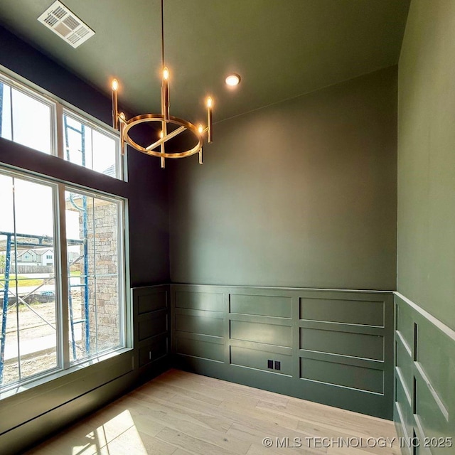17806 S 46 E Ave, Bixby, OK 74008 - empty room featuring light wood-type flooring, a wainscoted wall, a chandelier, a decorative wall, and recessed lighting