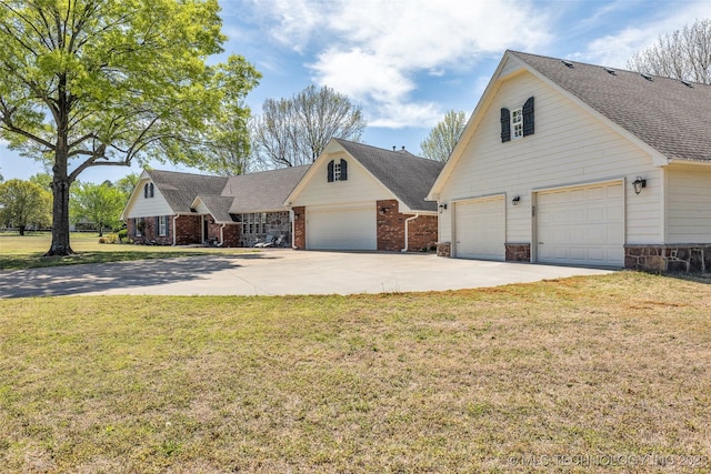 view of front facade featuring a shingled roof, brick siding, and a front lawn